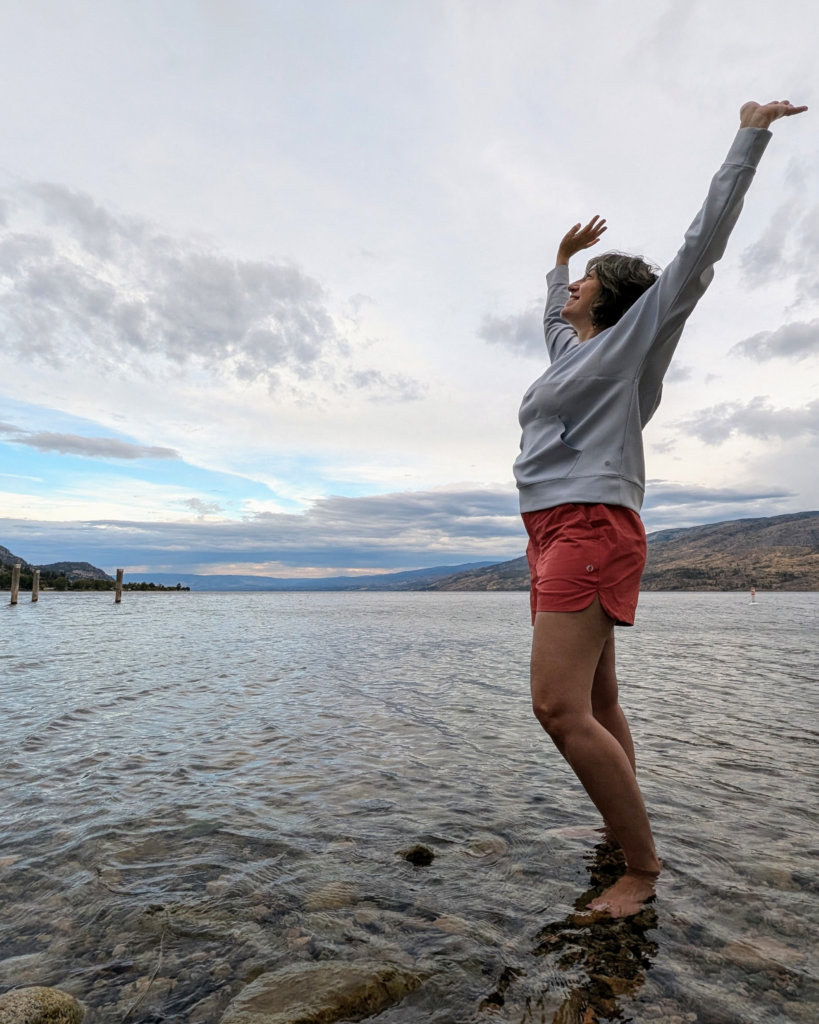 woman standing in a lake in British Columbia Canada