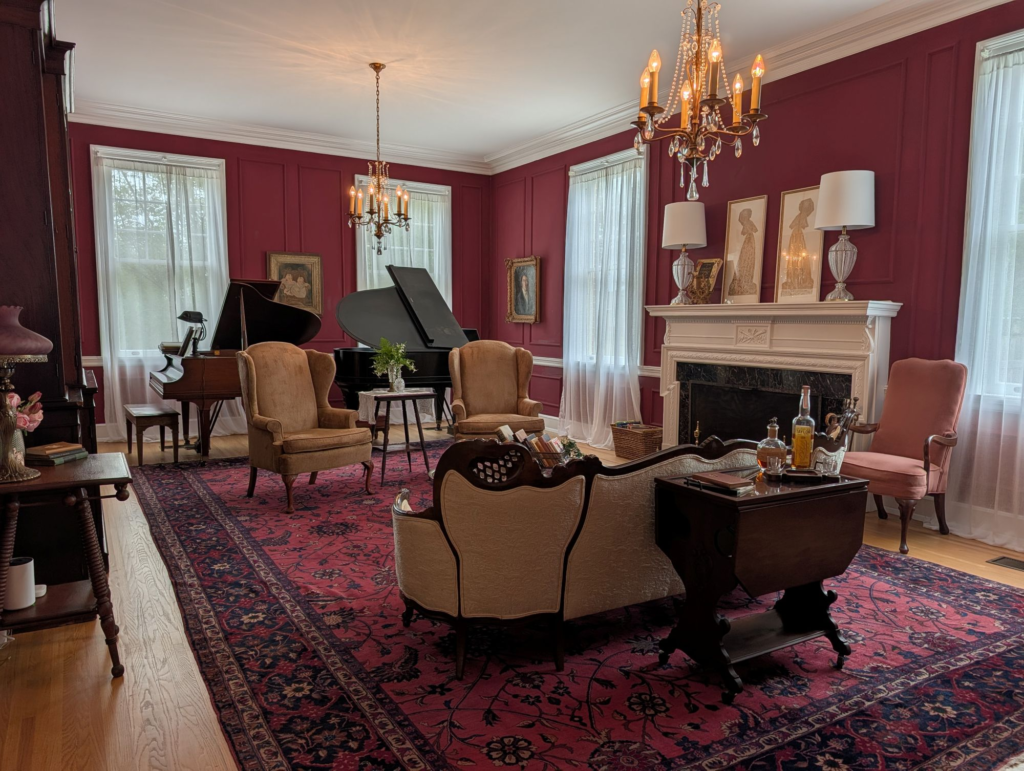 parlor with pianos, chandeliers and lounge furniture