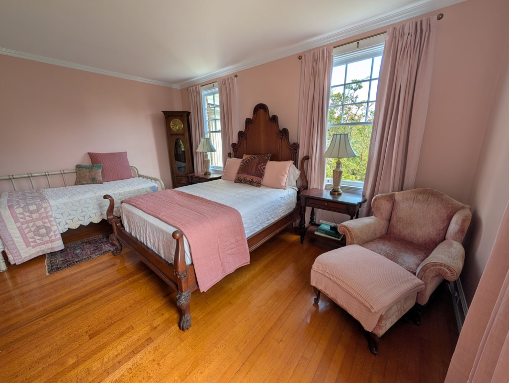 bedroom suite in soft pinks with lots of natural light