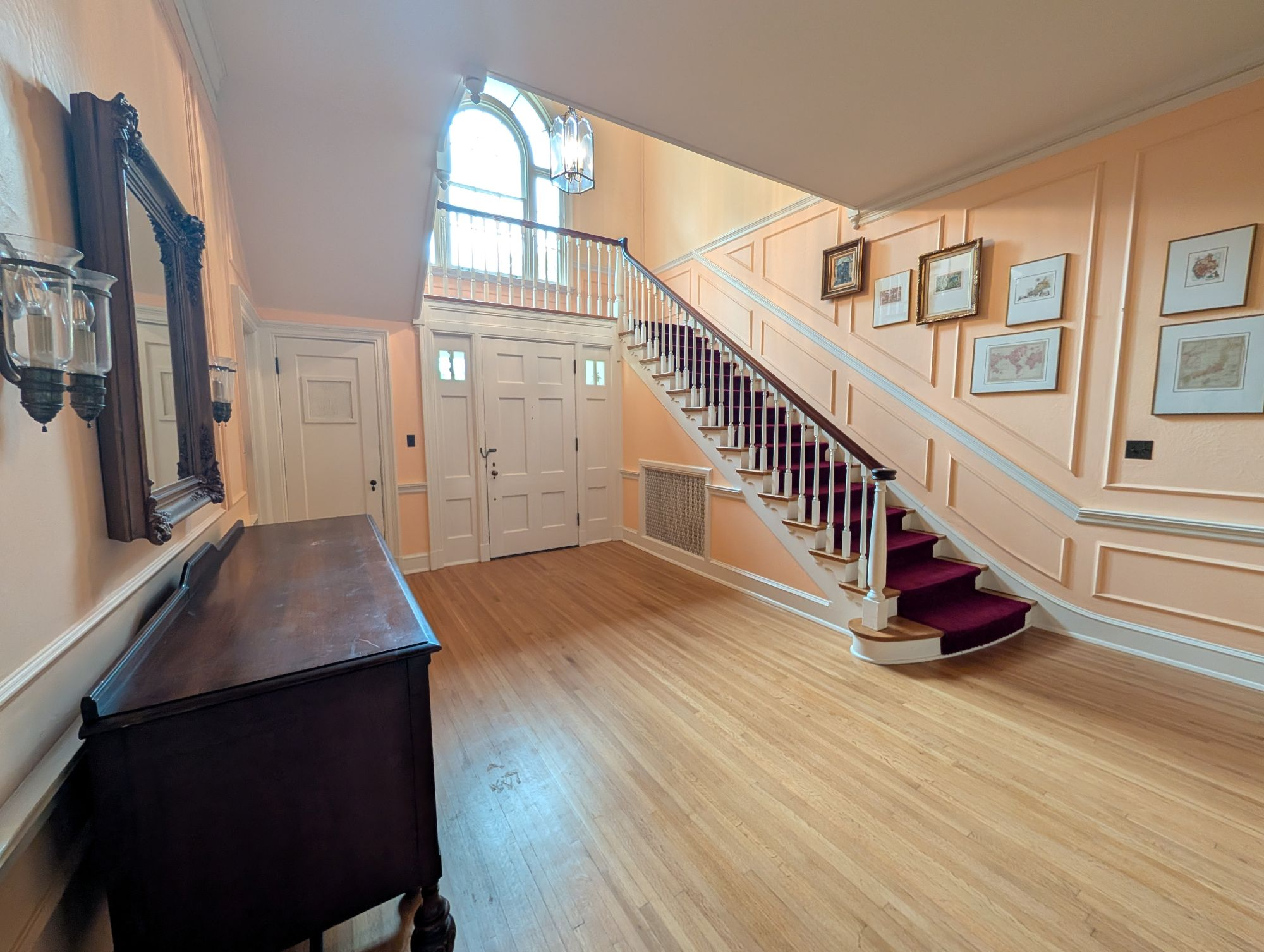 foyer with stairs and beautiful arched window