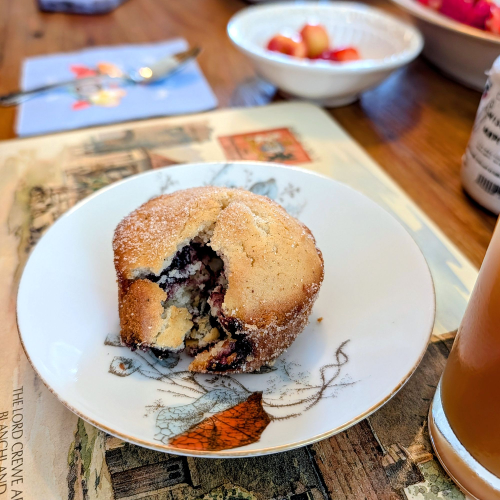 fruit stuffed French donut with fresh cherries on the side